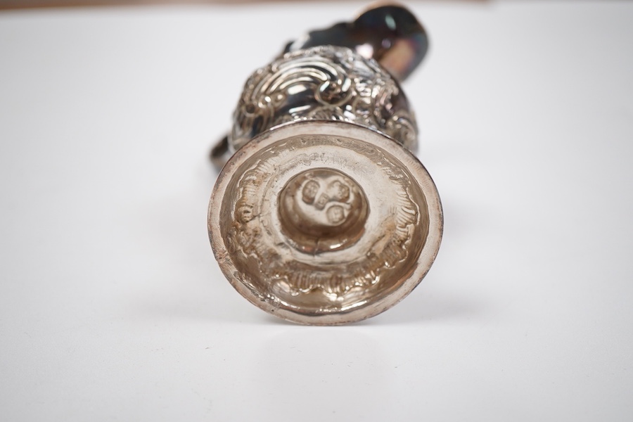 A George III silver inverted pyriform cream jug, with later embossed decoration, Charles Chesterman II, London, 1779?, height 11.4cm.